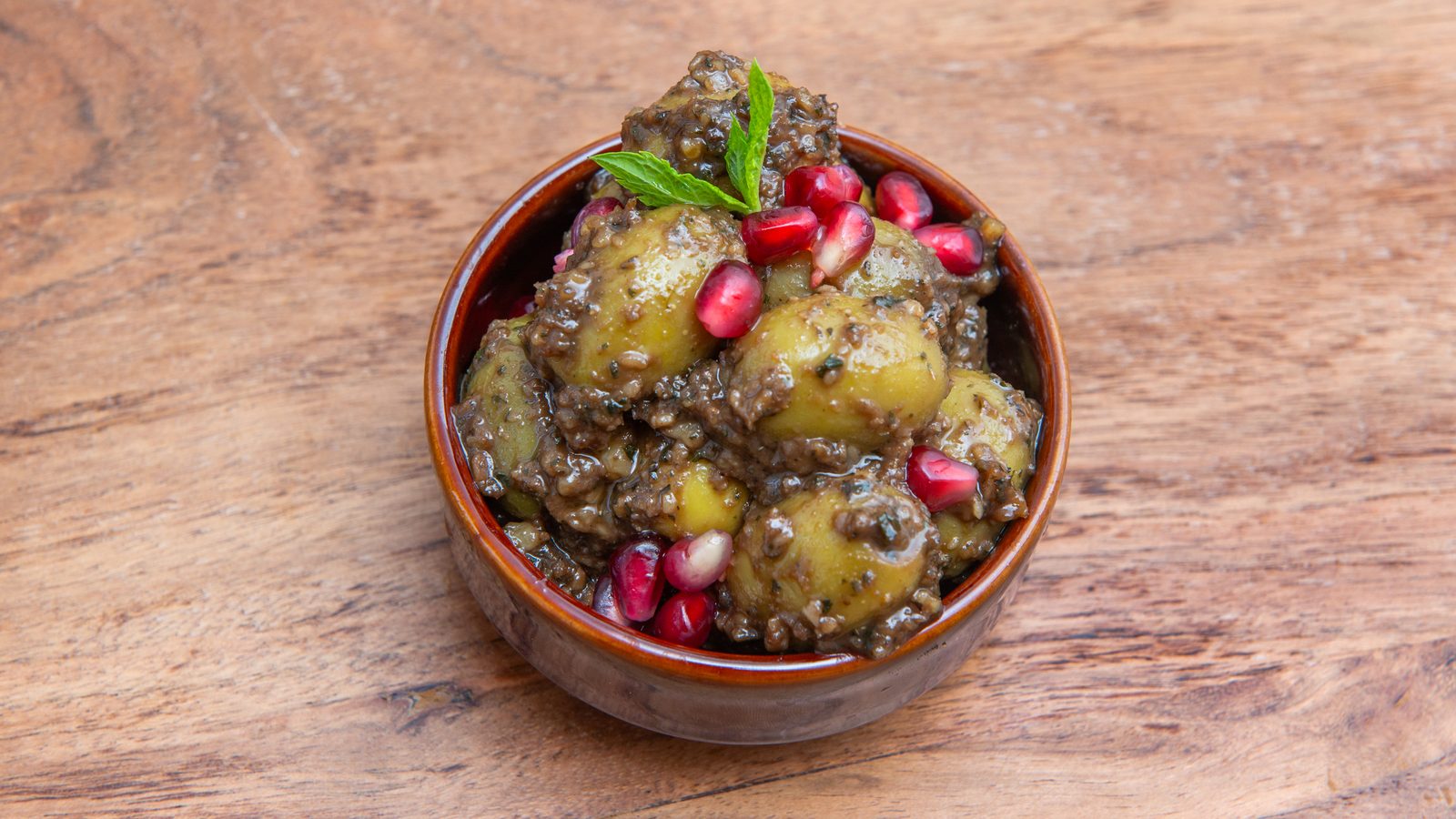 Zeytoon parvardeh in a ceramic pot